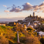 Countryside Landscape — Rolling hills, olive trees, and castles create a serene rural view.